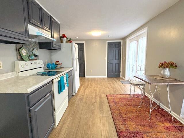 kitchen featuring light wood finished floors, under cabinet range hood, light countertops, white electric range oven, and baseboards