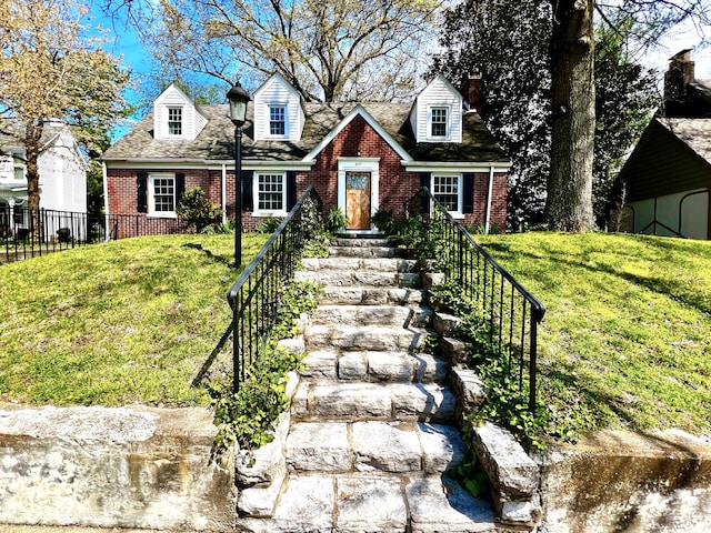 847 W Lexington Ave, Danville, KY 40422 - new england style home with brick siding, a front lawn, and fence