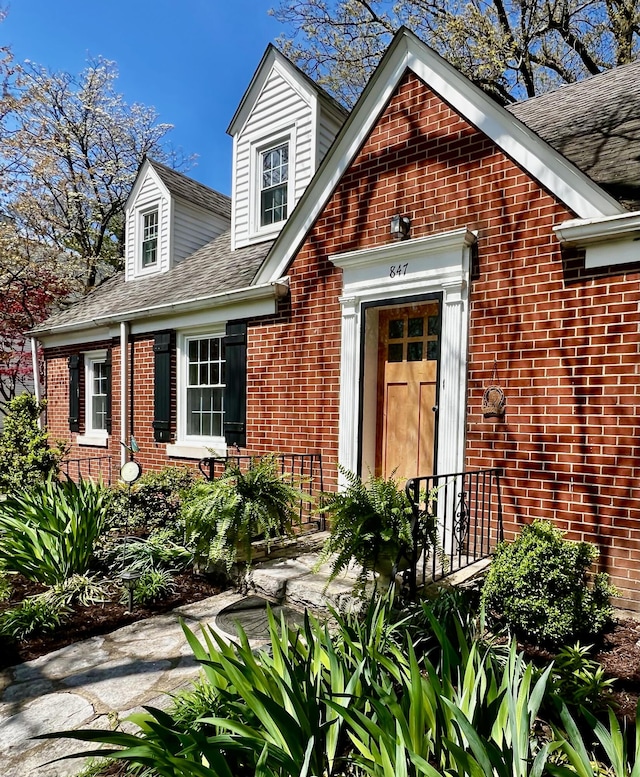 847 W Lexington Ave, Danville, KY 40422 - view of exterior entry featuring brick siding and roof with shingles
