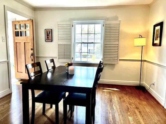 847 W Lexington Ave, Danville, KY 40422 - dining room with dark wood finished floors, crown molding, and baseboards