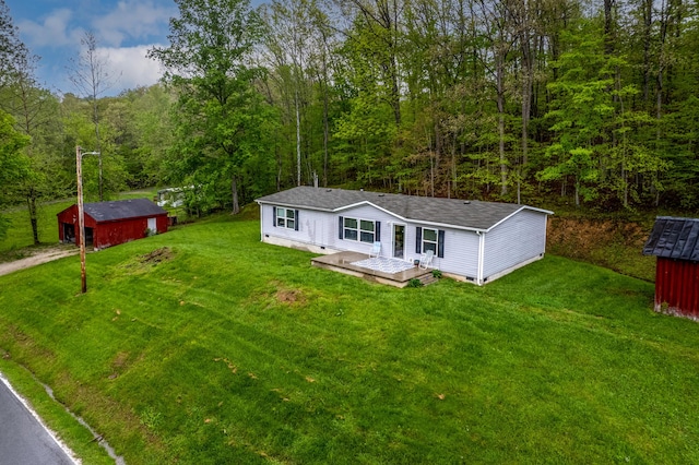 1132 State Highway 1662, Olive Hill, KY 41164 - exterior space with a wooden deck, an outdoor structure, a front lawn, and a forest view