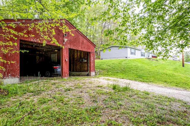 1132 State Highway 1662, Olive Hill, KY 41164 - exterior space featuring an outdoor structure, a garage, and an outbuilding