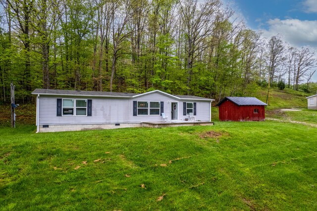 1132 State Highway 1662, Olive Hill, KY 41164 - view of front of home featuring a front yard, an outbuilding, and crawl space