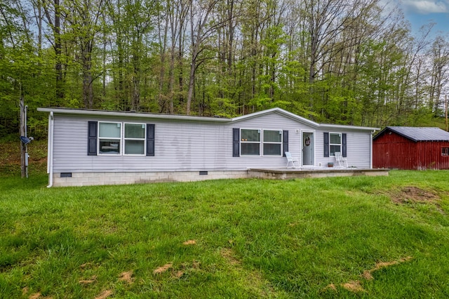 1132 State Highway 1662, Olive Hill, KY 41164 - manufactured / mobile home featuring an outdoor structure, a front lawn, and crawl space