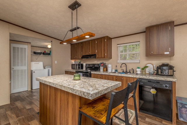 1132 State Highway 1662, Olive Hill, KY 41164 - kitchen with a sink, black appliances, washer and dryer, under cabinet range hood, and light countertops