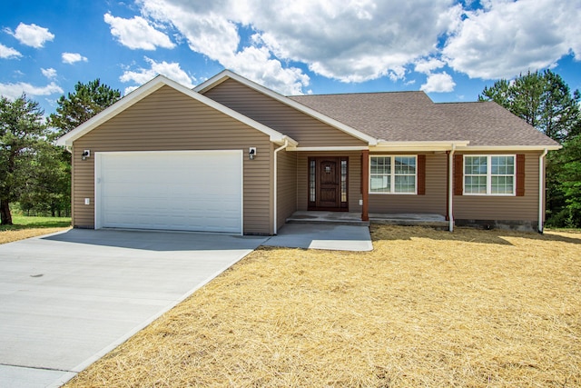 ranch-style home with driveway, a garage, and roof with shingles