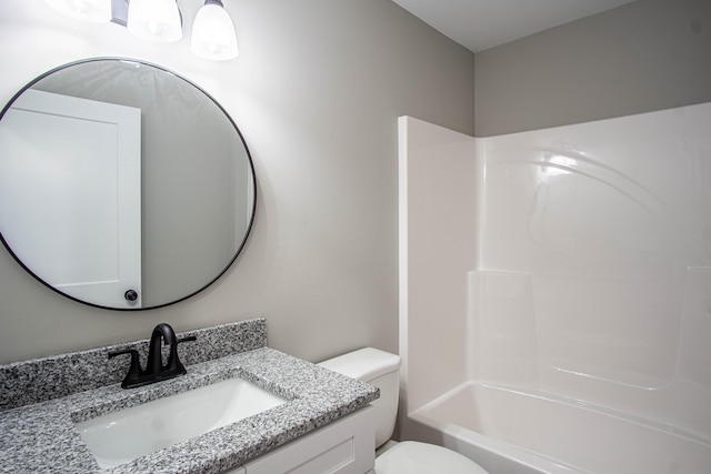 bathroom featuring toilet and vanity