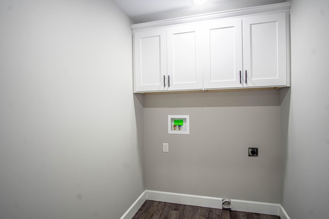 washroom with hookup for an electric dryer, baseboards, hookup for a washing machine, cabinet space, and dark wood finished floors