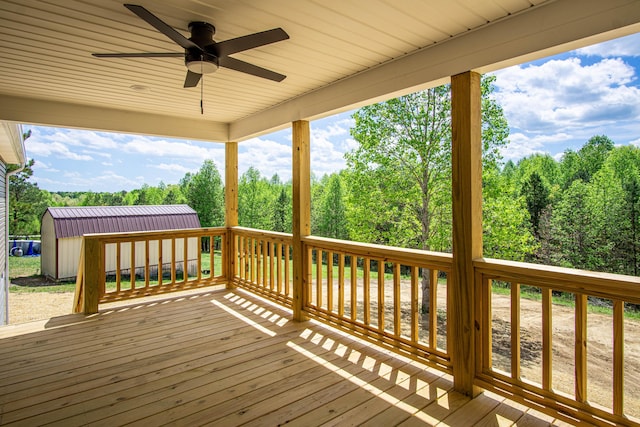 wooden deck with a ceiling fan