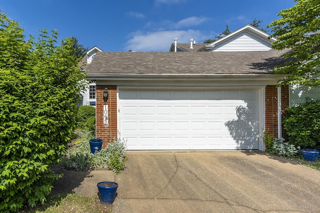 garage featuring driveway