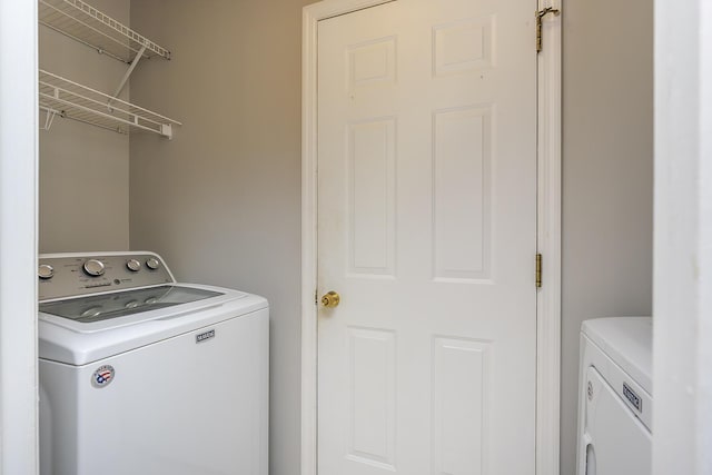 laundry room with washing machine and dryer