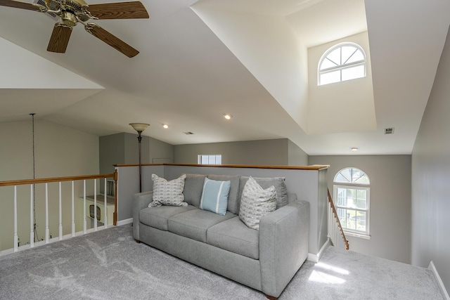living area featuring carpet, a ceiling fan, plenty of natural light, vaulted ceiling, and recessed lighting