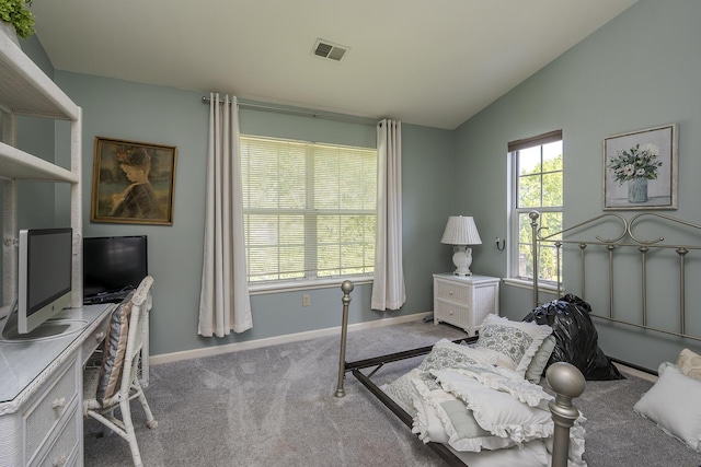 interior space with vaulted ceiling, baseboards, and an office area
