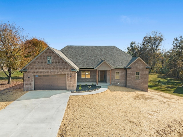 35 Valley Pointe Dr, Somerset, KY 42501 - view of front of house with driveway, a shingled roof, and brick siding