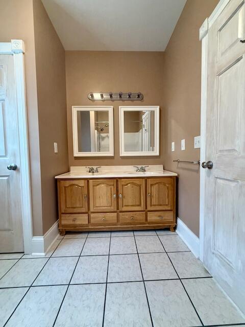 301 Lattern Way, Frenchburg, KY 40322 - full bath with baseboards, tile patterned floors, double vanity, and a sink