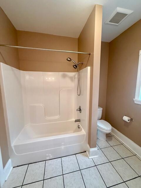301 Lattern Way, Frenchburg, KY 40322 - bathroom with tile patterned floors, baseboards, toilet, and tub / shower combination