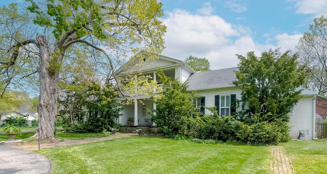 310 S Main St, Versailles, KY 40383 - neoclassical home featuring a porch, a front lawn, and a balcony