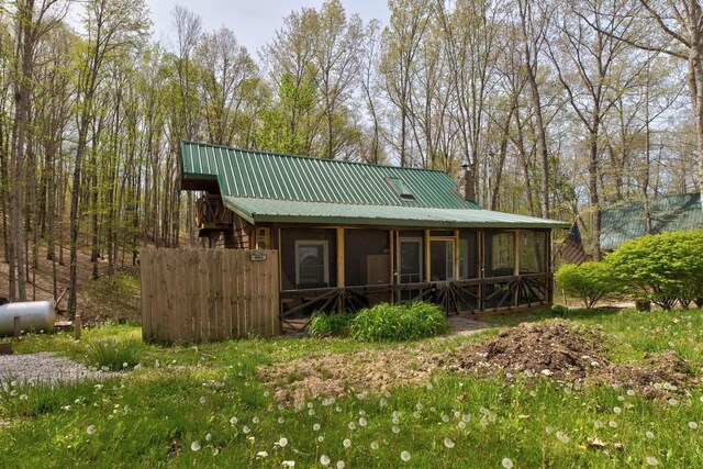 494 Deer Run Rd, Wellington, KY 40387 - back of house with a chimney, a sunroom, and metal roof