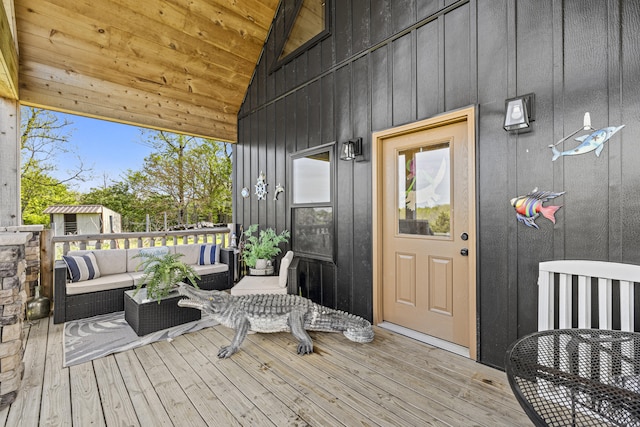 entrance to property with an outdoor hangout area and board and batten siding