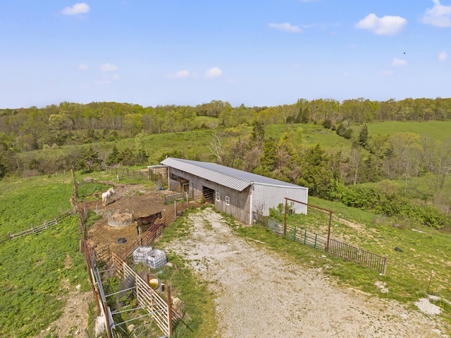 aerial view with a rural view and a view of trees