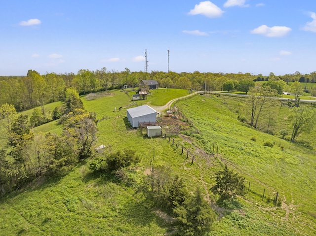 birds eye view of property featuring a rural view