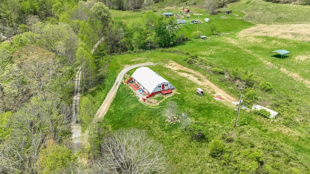 birds eye view of property with a rural view