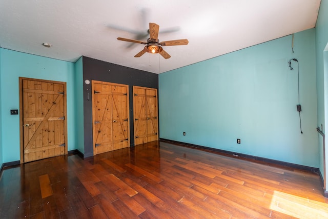 unfurnished bedroom with baseboards, a ceiling fan, and wood finished floors