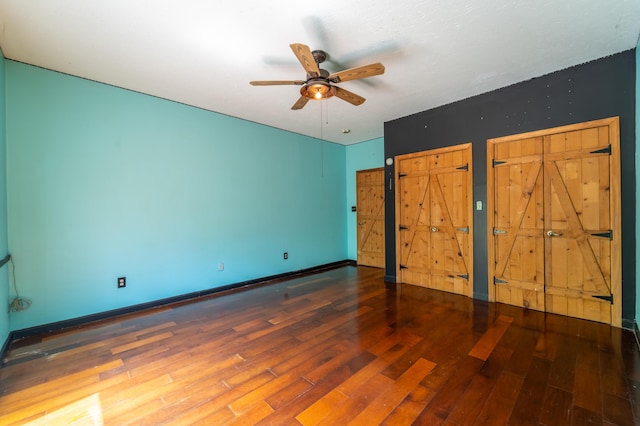 unfurnished bedroom featuring baseboards, a ceiling fan, and wood finished floors