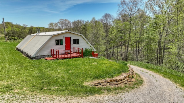 view of outdoor structure with a wooded view