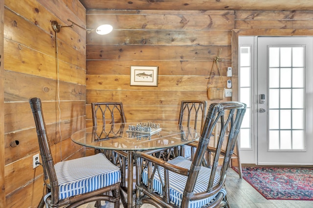 293 Deer Run Rd, Wellington, KY 40387 - dining space featuring wood-type flooring and wooden walls