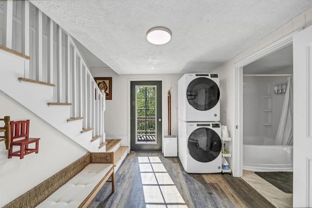 293 Deer Run Rd, Wellington, KY 40387 - clothes washing area with stacked washer / drying machine, a textured ceiling, and wood finished floors