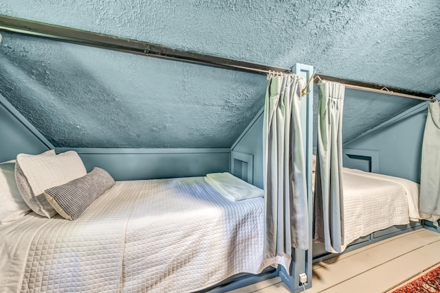 293 Deer Run Rd, Wellington, KY 40387 - bedroom with a textured ceiling and lofted ceiling