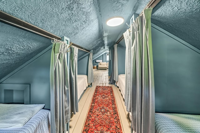293 Deer Run Rd, Wellington, KY 40387 - bedroom with lofted ceiling and a textured ceiling