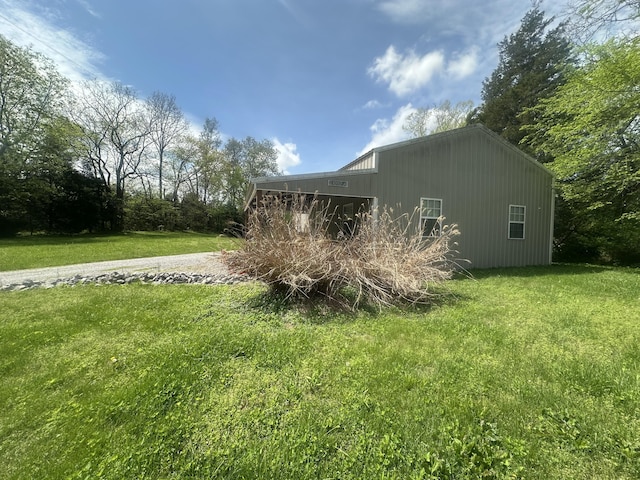 view of home's exterior with a yard