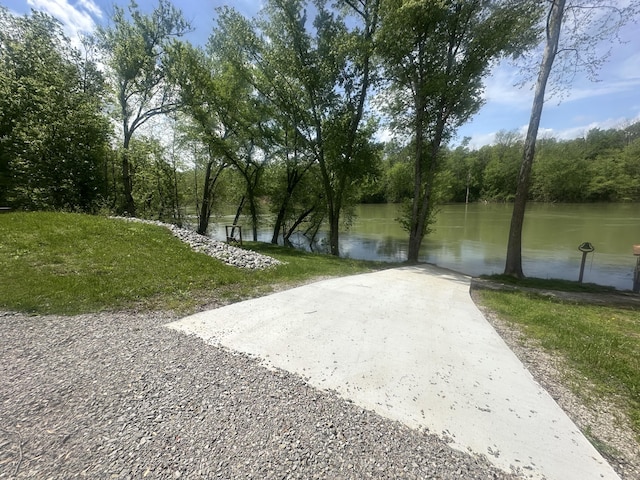 view of community with a water view and driveway