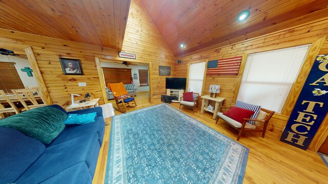 living room featuring wood finished floors, wooden walls, recessed lighting, wood ceiling, and vaulted ceiling
