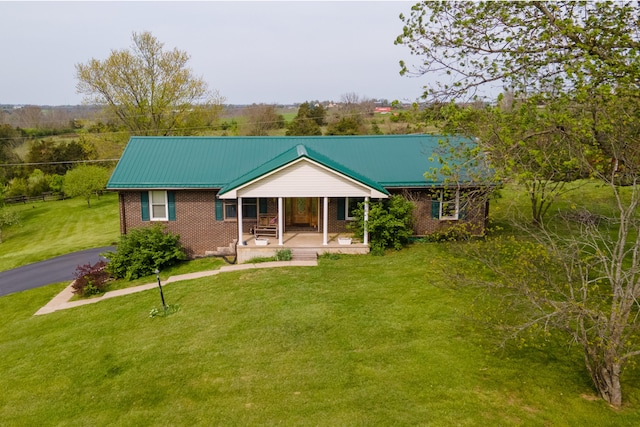 138 Hackett Pike, Richmond, KY 40475 - chalet / cabin with a front yard, covered porch, and brick siding
