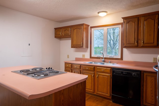138 Hackett Pike, Richmond, KY 40475 - kitchen featuring black dishwasher, stainless steel electric cooktop, a sink, and brown cabinets