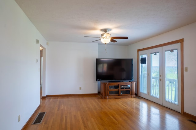 138 Hackett Pike, Richmond, KY 40475 - living room with light wood-style flooring, ceiling fan, baseboards, visible vents, and french doors