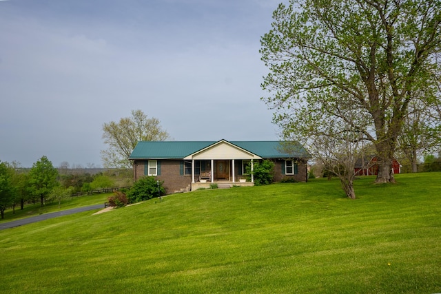138 Hackett Pike, Richmond, KY 40475 - single story home with brick siding, a porch, aphalt driveway, and a front yard