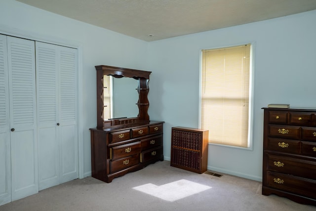 138 Hackett Pike, Richmond, KY 40475 - bedroom featuring visible vents, light carpet, baseboards, and a closet
