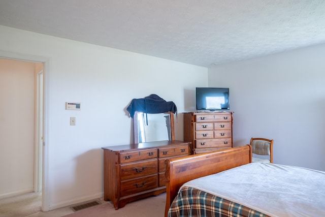 138 Hackett Pike, Richmond, KY 40475 - bedroom featuring a textured ceiling, visible vents, baseboards, and light carpet