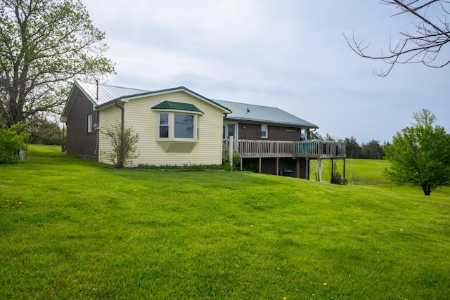 138 Hackett Pike, Richmond, KY 40475 - back of property featuring a yard, a wooden deck, and metal roof