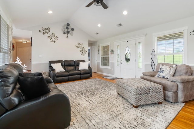 living room with recessed lighting, a ceiling fan, visible vents, vaulted ceiling, and wood finished floors