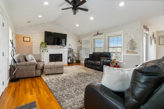 living room with recessed lighting, lofted ceiling, ceiling fan, and wood finished floors