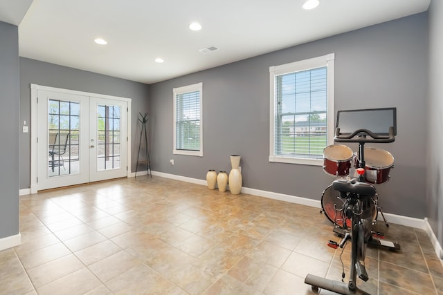 workout room featuring visible vents, recessed lighting, light tile patterned floors, and french doors