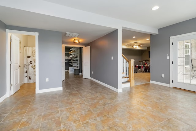 interior space featuring recessed lighting, ceiling fan, baseboards, stairway, and light tile patterned flooring