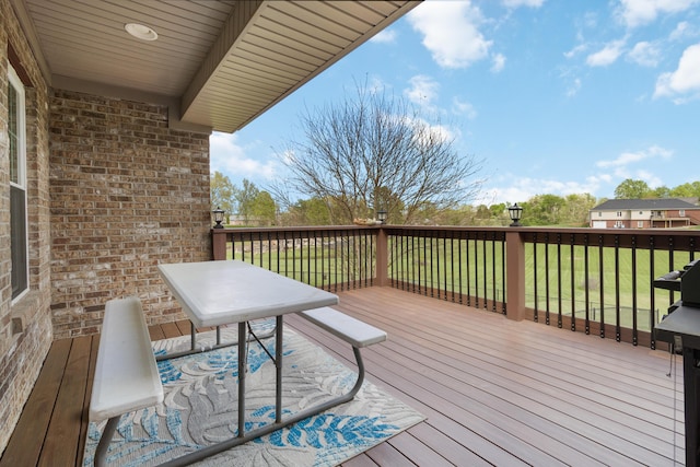 wooden deck with a yard