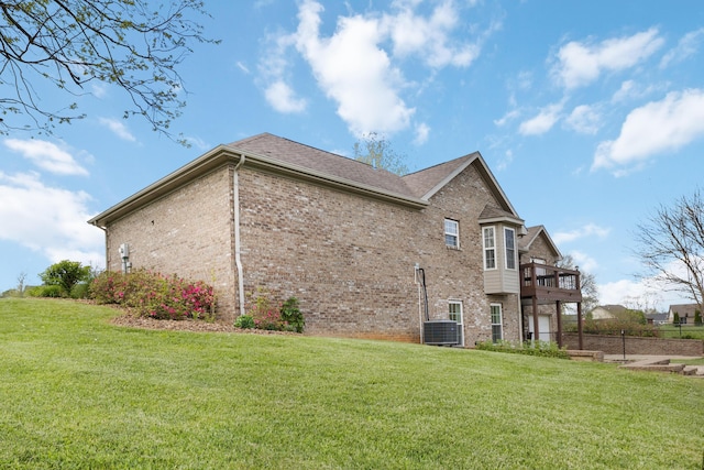 view of property exterior with a yard and brick siding