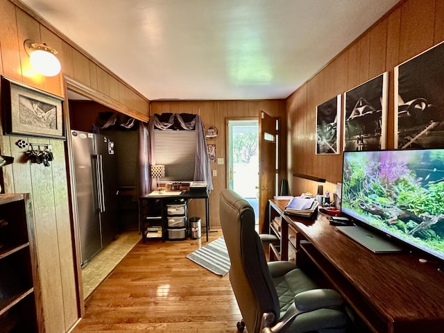 office area with wood walls and wood finished floors